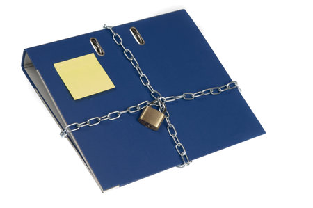 Padlock and chain on folderの写真素材