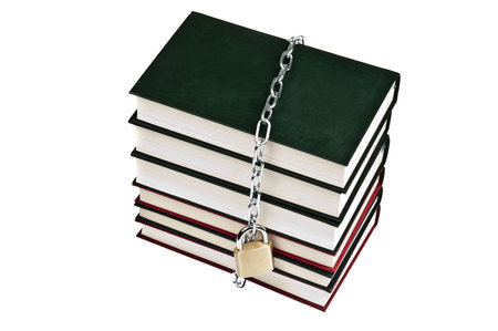 Padlock and book on whiteの写真素材