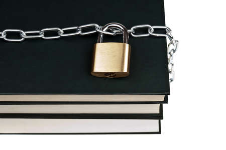 Padlock and book on whiteの写真素材
