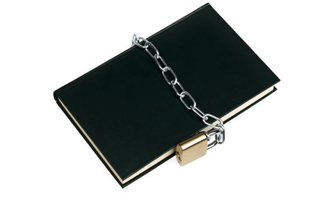 Padlock and book on whiteの写真素材