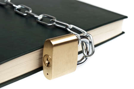 Padlock and book on whiteの写真素材