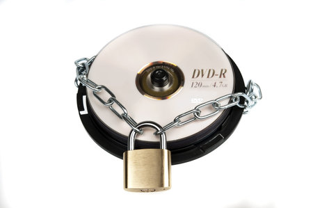 Padlock and cd on whiteの写真素材