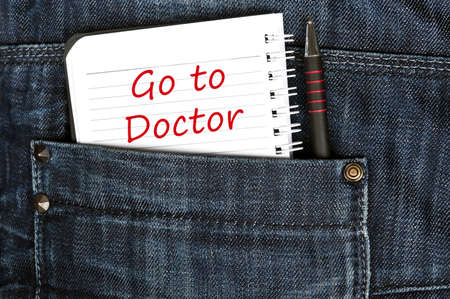 Go to doctor message on notepadの写真素材