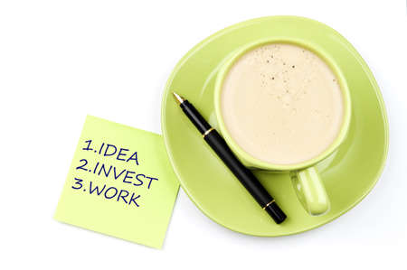 Business plan on note and coffeeの写真素材