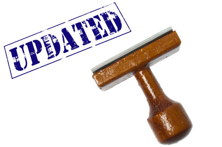 Updated stamp on white backgroundの写真素材