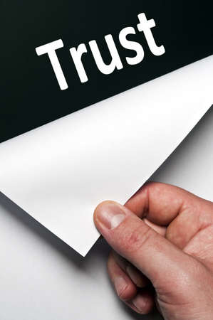Trust word discovered by male handの写真素材
