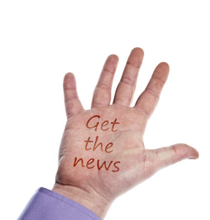 Get the news writed on handの写真素材