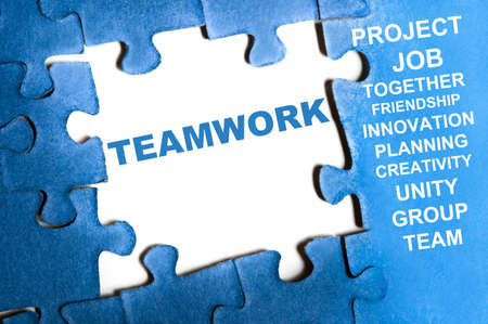 Teamwork blue puzzle pieces assembledの写真素材