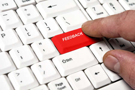 Feedback key pressed by male handの写真素材