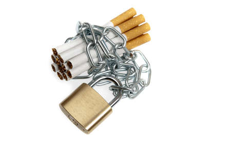 Cigarettes locked on white backgroundの写真素材