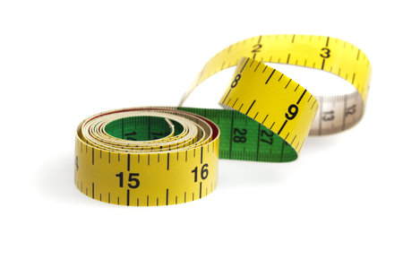 Measurement tape on white backgroundの写真素材