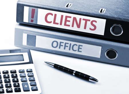 Clients write on folder and office toolsの写真素材