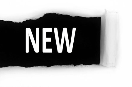 New word discovered under paperの写真素材