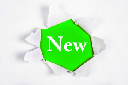 New word discovered under paperの写真素材