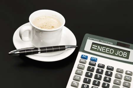 Need Job result on electronic calculator and coffeeの写真素材