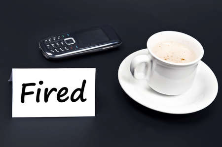 Fired message on desk with coffeeの写真素材