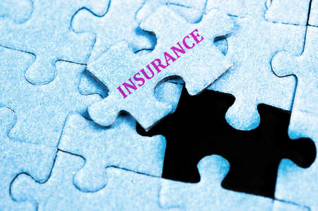 Insurance piece of puzzle on topの写真素材