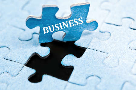 Business piece of puzzle stand upの写真素材