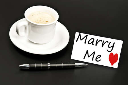Marry me message on desk with coffeeの写真素材
