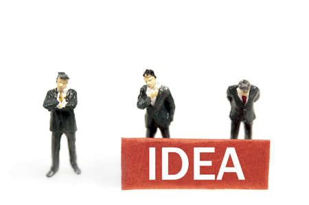 Idea note and business man toysの写真素材