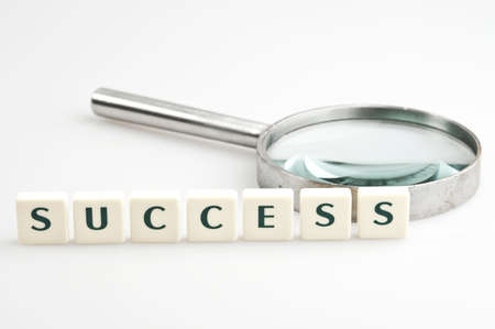 Success word and magnifying glassの写真素材