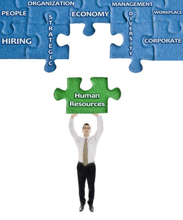 Human Resources word on puzzle in man hands Human Resources word on puzzle in man hands