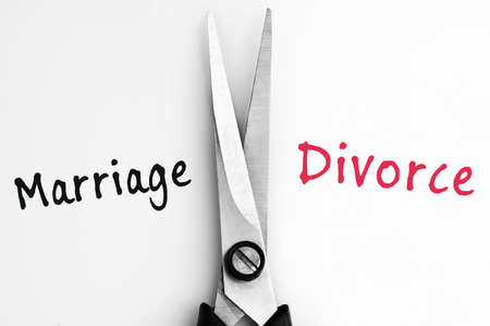 Marriage and Divorce words with scissors in middleの写真素材