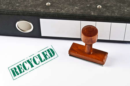 Recycled stamp on white paperの写真素材