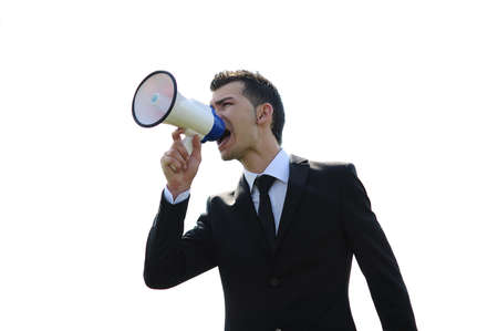 Business man with loudspeaker outsideの写真素材