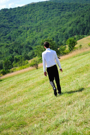 Business man standing in natureの写真素材