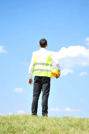 Construction worker on hill and skyの写真素材