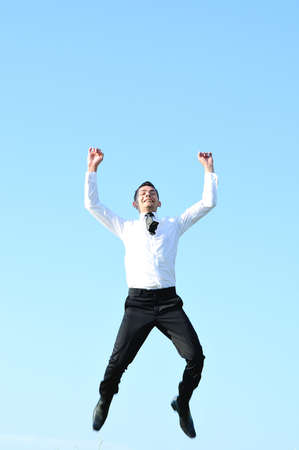 Business man jump at skyの写真素材