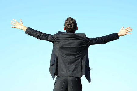 Business man happy on skyの写真素材