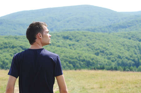 Pensive young boy in natureの写真素材