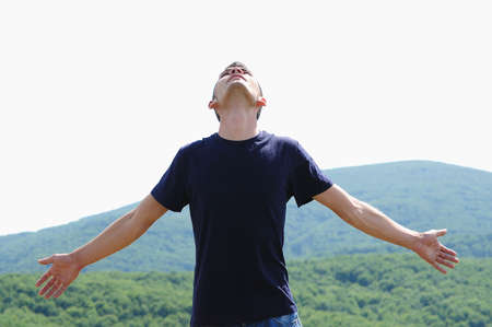 Young boy looking at the skyの写真素材