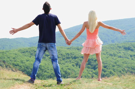 Young couple freedom concept in nature