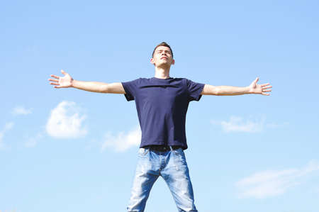 Young boy looking at the skyの写真素材