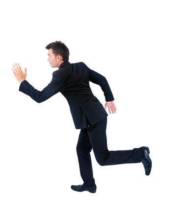 Isolated young business man runningの写真素材