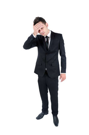 Isolated young business man headacheの写真素材