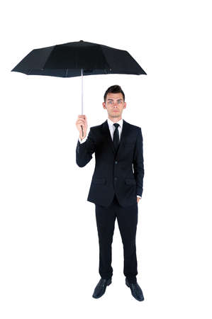 Isolated young business man with umbrellaの写真素材