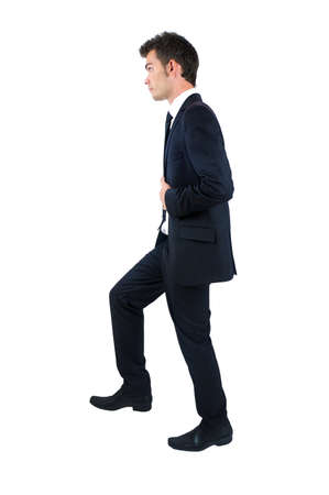 Isolated young business man foot upの写真素材