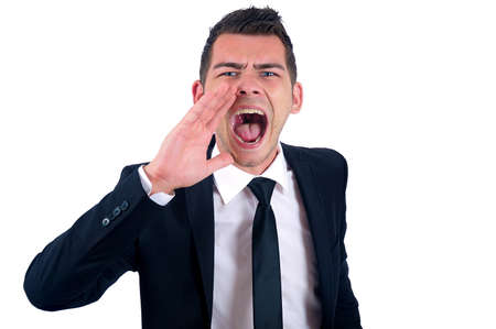 Isolated young business man screamingの写真素材