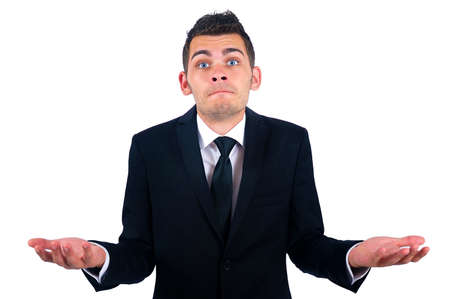 Isolated young business man confusedの写真素材
