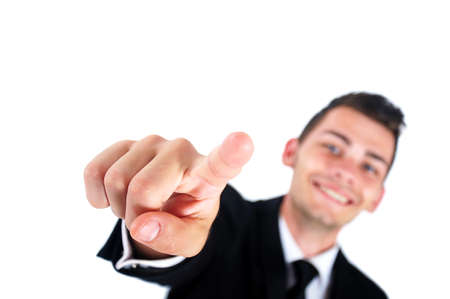 Isolated young business man pointingの写真素材