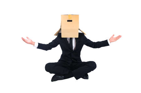 Isolated business man with box on headの写真素材