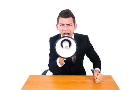 Isolated business man screaming with loudspeakerの写真素材