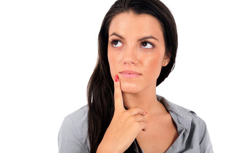 Isolated young business woman thinking