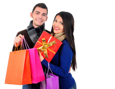 Isolated young casual couple with shopping bag