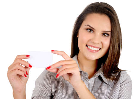 Isolated young business woman showing cardの写真素材