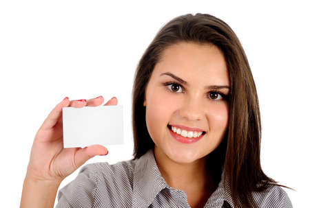 Isolated young business woman showing cardの写真素材